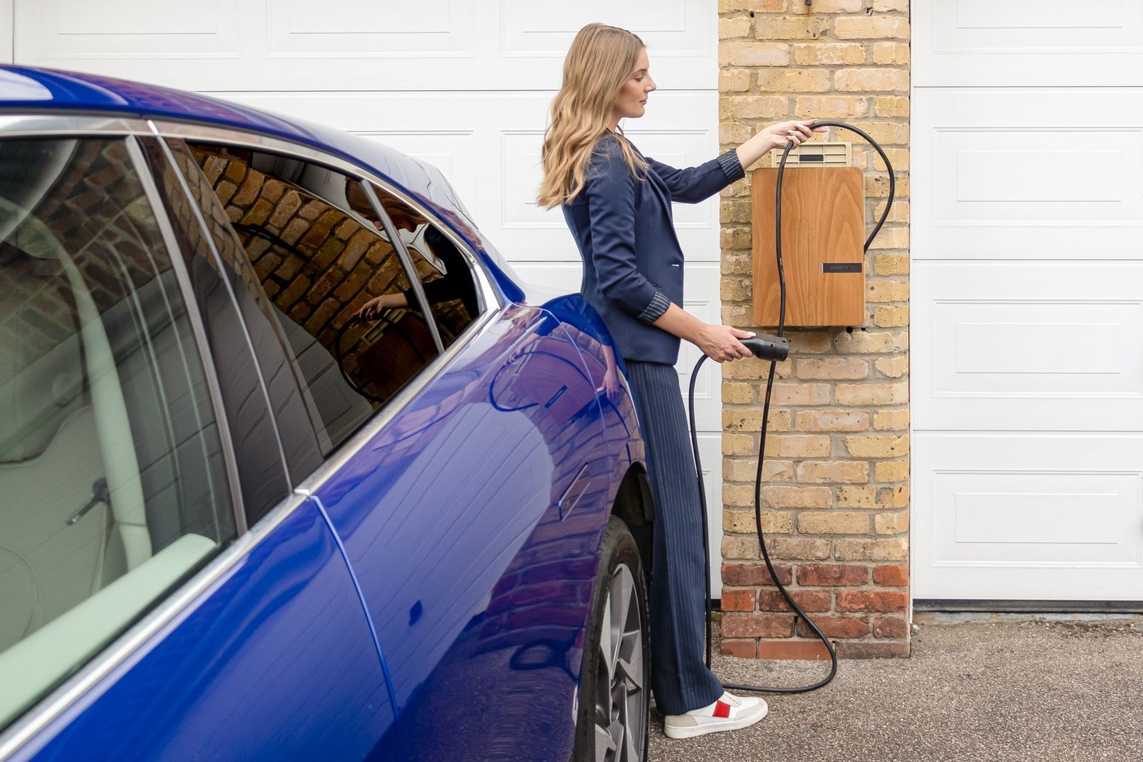 Level 2 EV home charger installed on a garage wall
